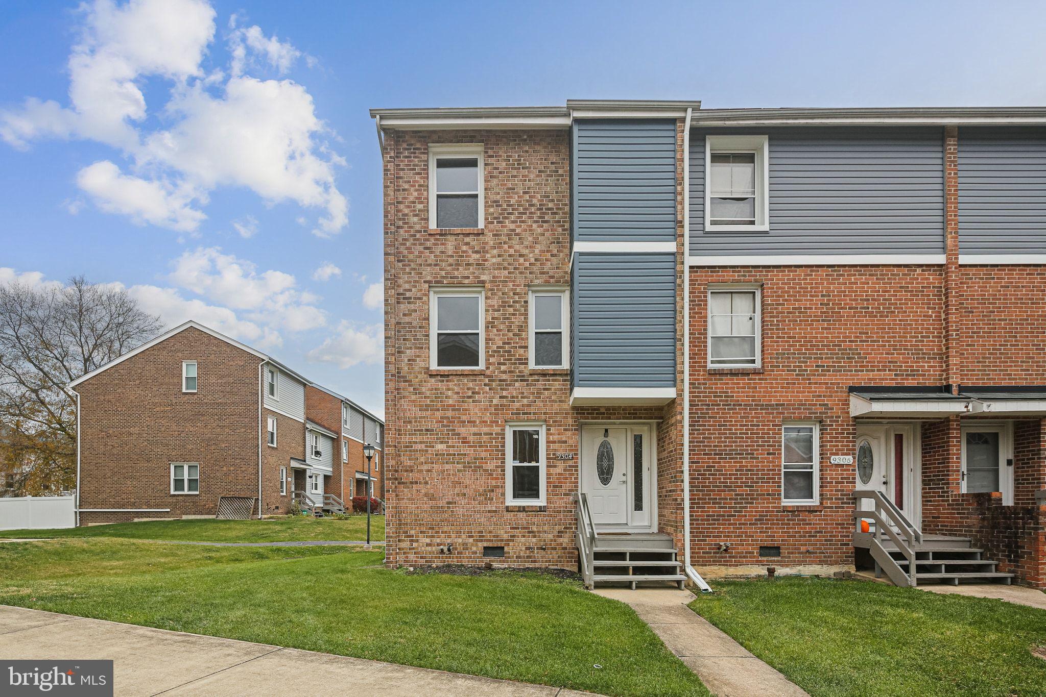 Charming brick townhouse with modern accents.
