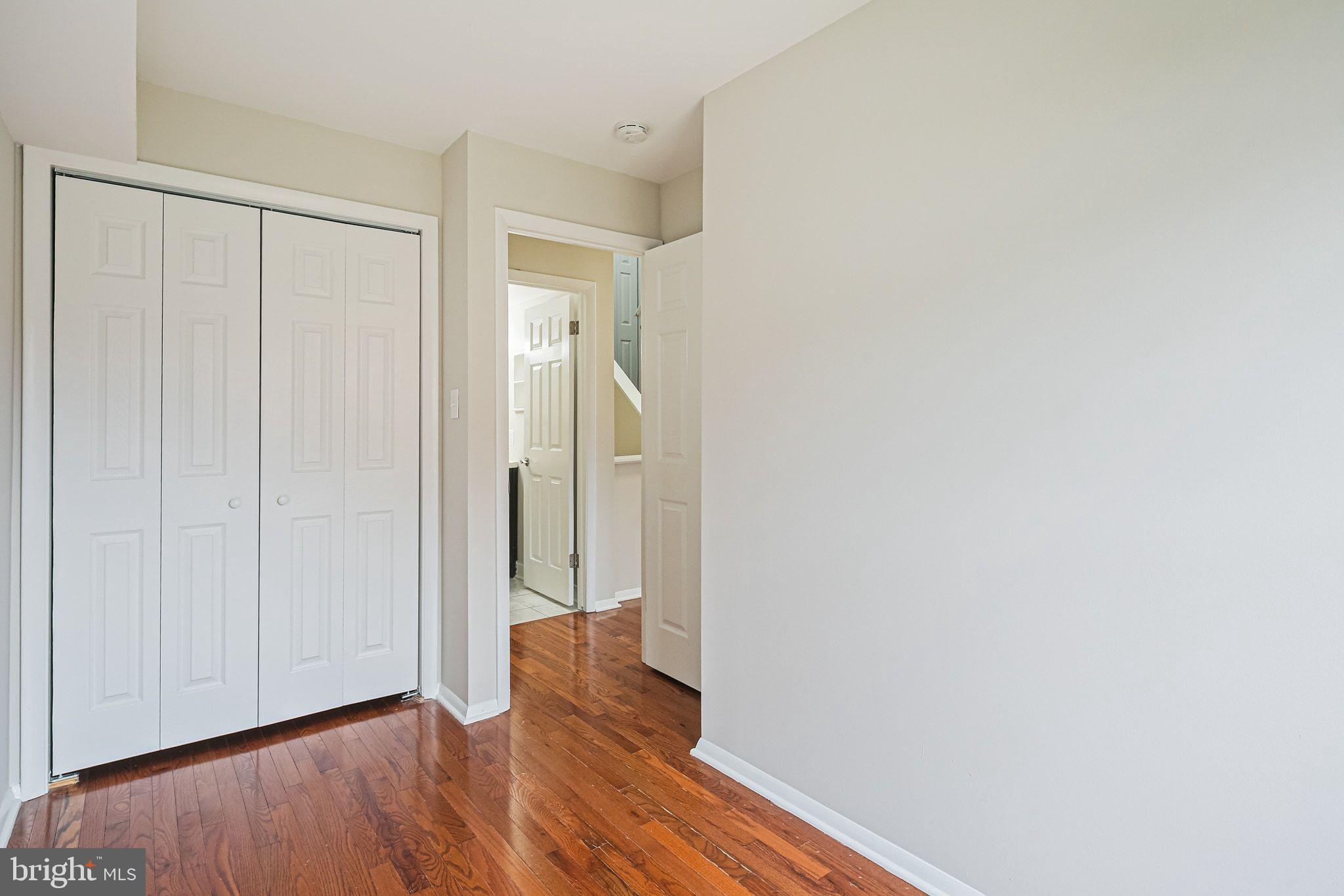 9304 Canterbury Riding, Unit 21 Laurel, MD 20723 - Photo 14 of 29 a view of a hallway with wooden floor