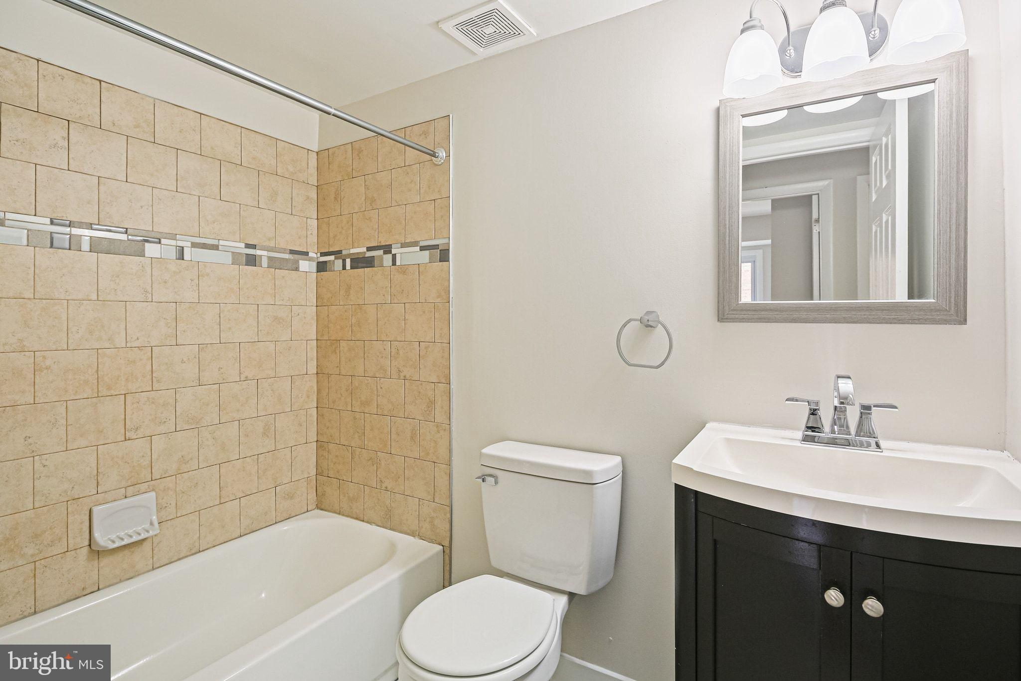 9304 Canterbury Riding, Unit 21 Laurel, MD 20723 - Photo 15 of 29 a bathroom with a sink toilet and shower