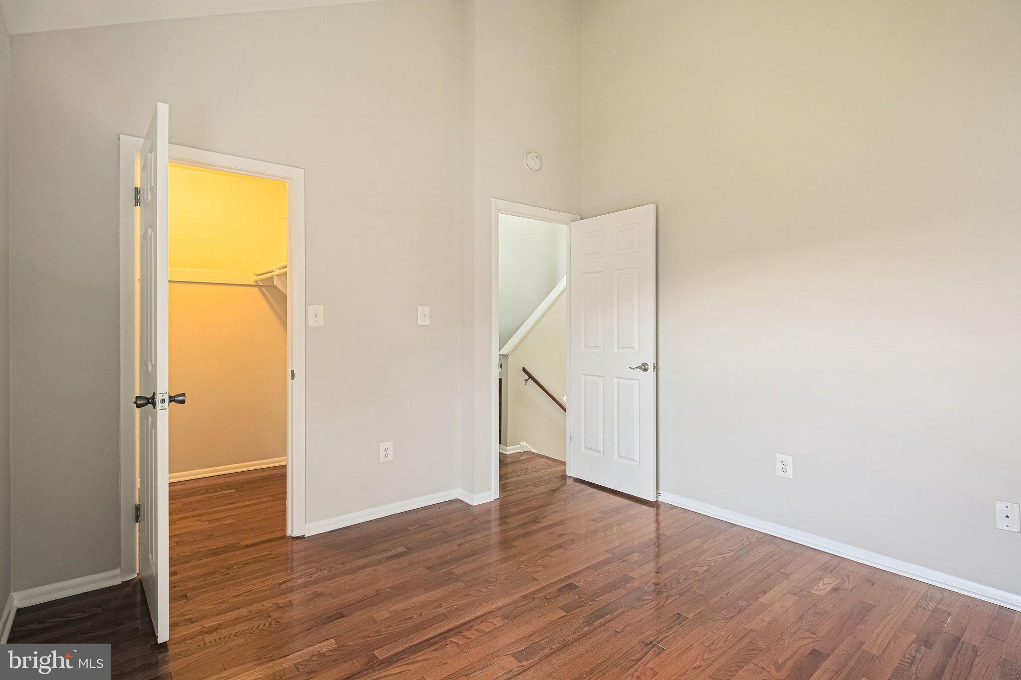 9304 Canterbury Riding, Unit 21 Laurel, MD 20723 - Photo 16 of 29 a view of an empty room with wooden floor and a window