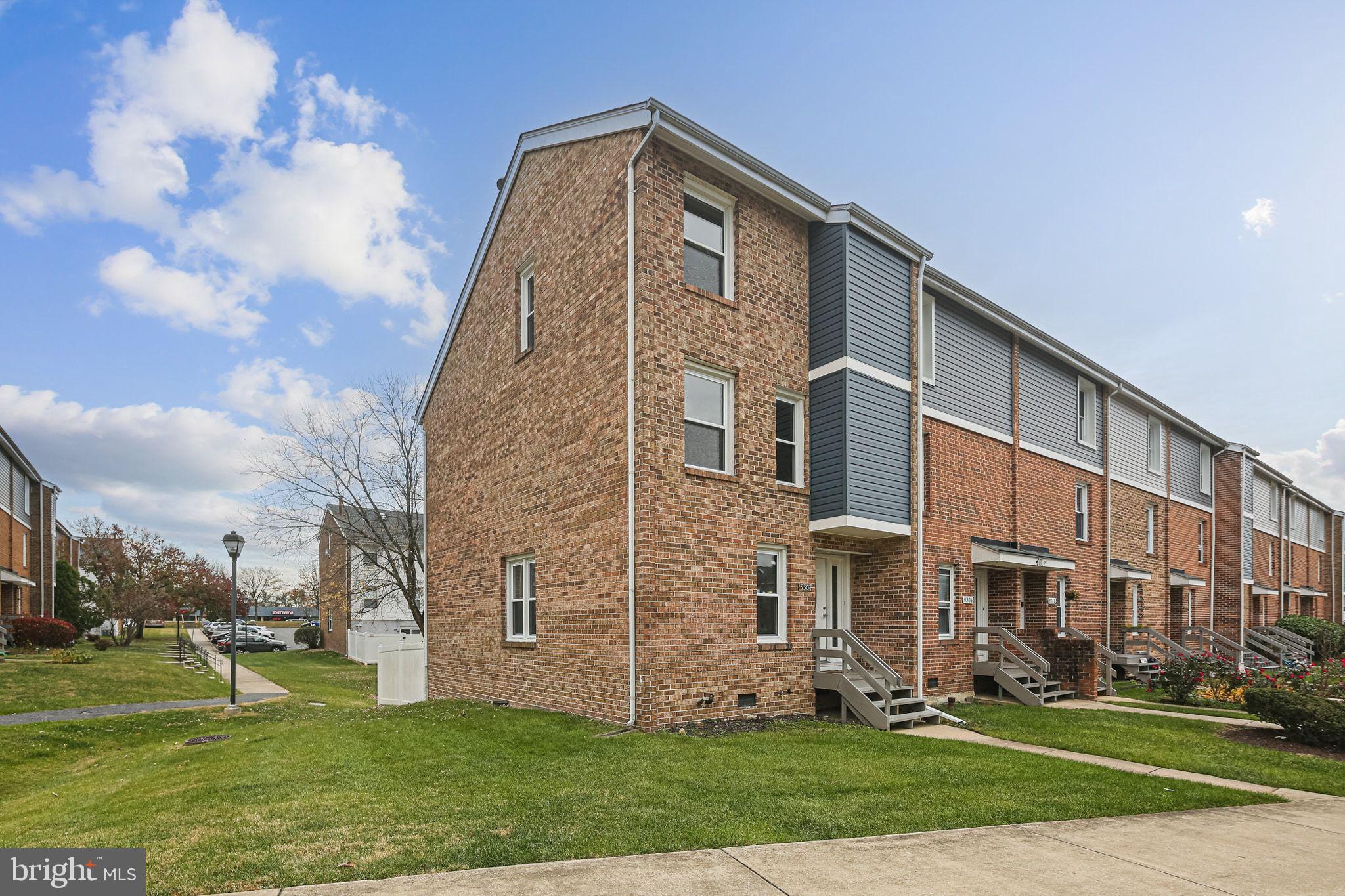 9304 Canterbury Riding, Unit 21 Laurel, MD 20723 - Photo 2 of 29 a front view of a building with garden