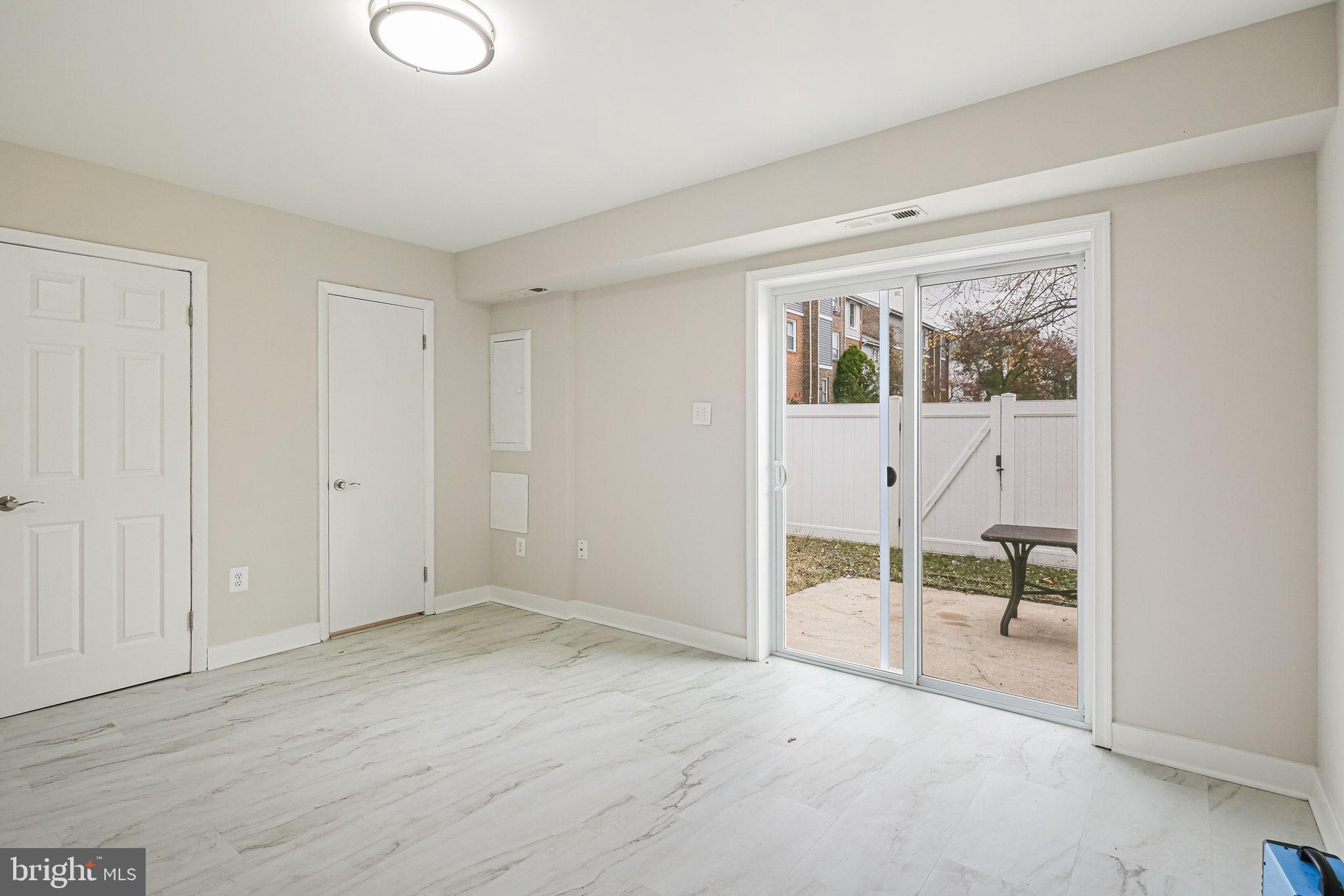 9304 Canterbury Riding, Unit 21 Laurel, MD 20723 - Photo 22 of 29 a view of empty room with wooden floor and fan