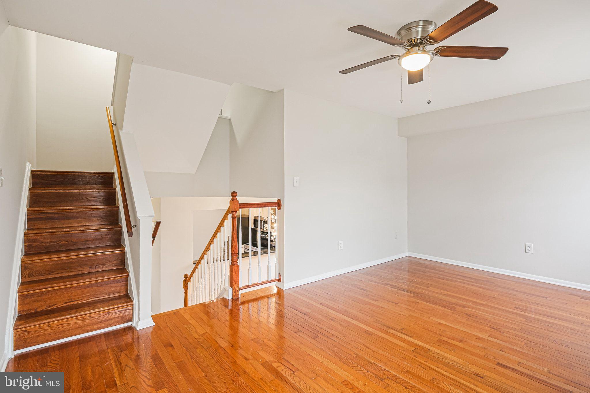 9304 Canterbury Riding, Unit 21 Laurel, MD 20723 - Photo 8 of 29 wooden floor in a hall with an entryway