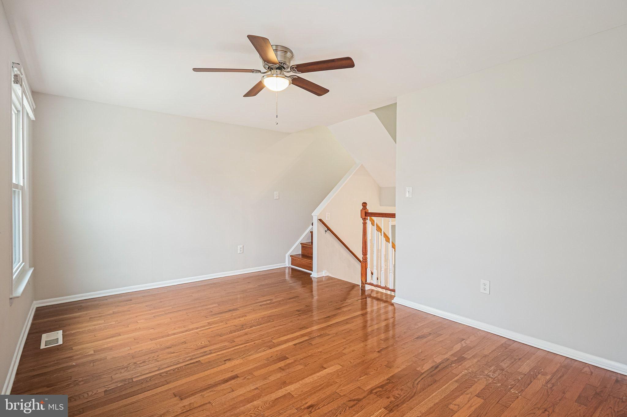 9304 Canterbury Riding, Unit 21 Laurel, MD 20723 - Photo 10 of 29 a view of wooden floor in an empty room
