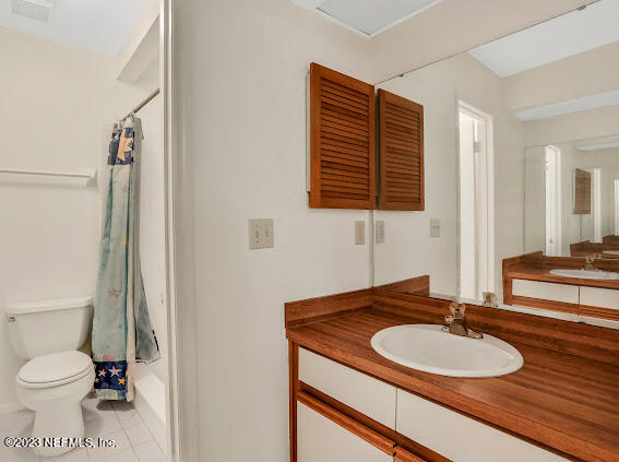 85 Debarry Avenue, Unit 1066 Orange Park, FL 32073 - Photo 21 of 24 a bathroom with a sink a toilet and a mirror