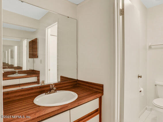85 Debarry Avenue, Unit 1066 Orange Park, FL 32073 - Photo 22 of 24 a bathroom with a sink and a mirror