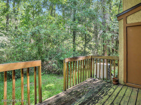 85 Debarry Avenue, Unit 1066 Orange Park, FL 32073 - Photo 3 of 24 a balcony with trees in front of it