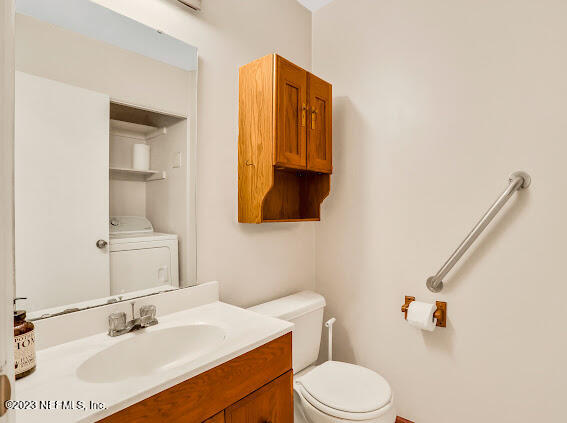 85 Debarry Avenue, Unit 1066 Orange Park, FL 32073 - Photo 5 of 24 a bathroom with a sink vanity mirror and toilet