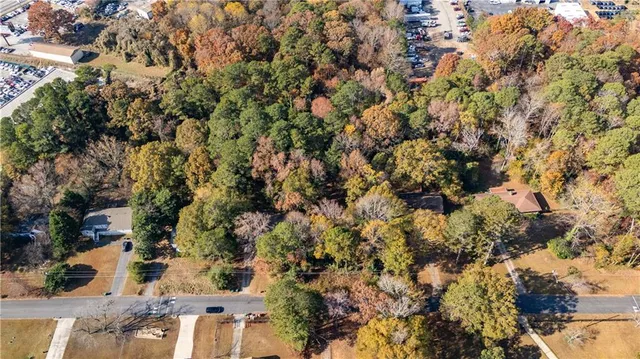 a view of a yard with a tree