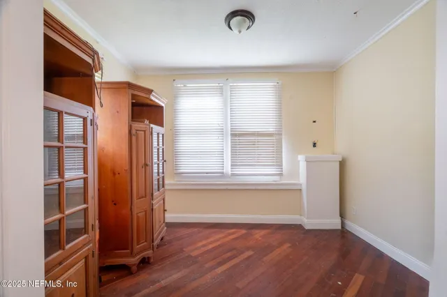 a bed room with a bed and a window