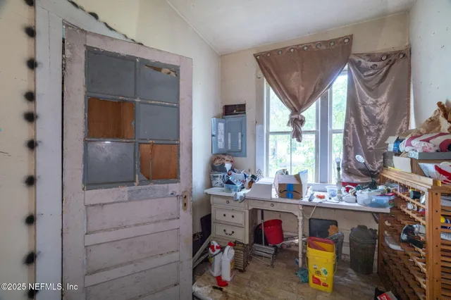 a view of a backyard with large trees