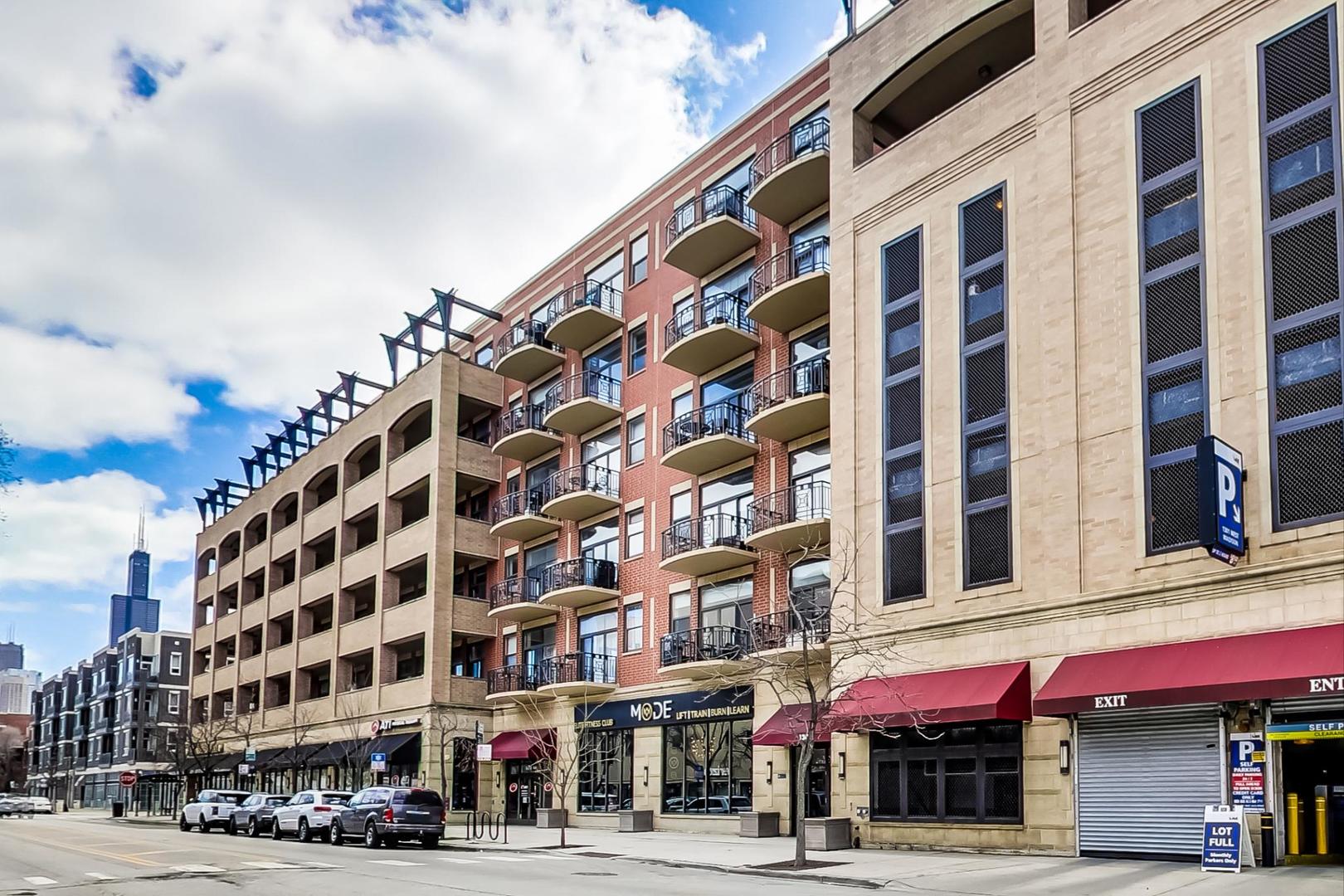 1301 West Madison Street, Unit 511 Chicago, IL 60607 - Photo 1 of 24 a front view of a building with a street