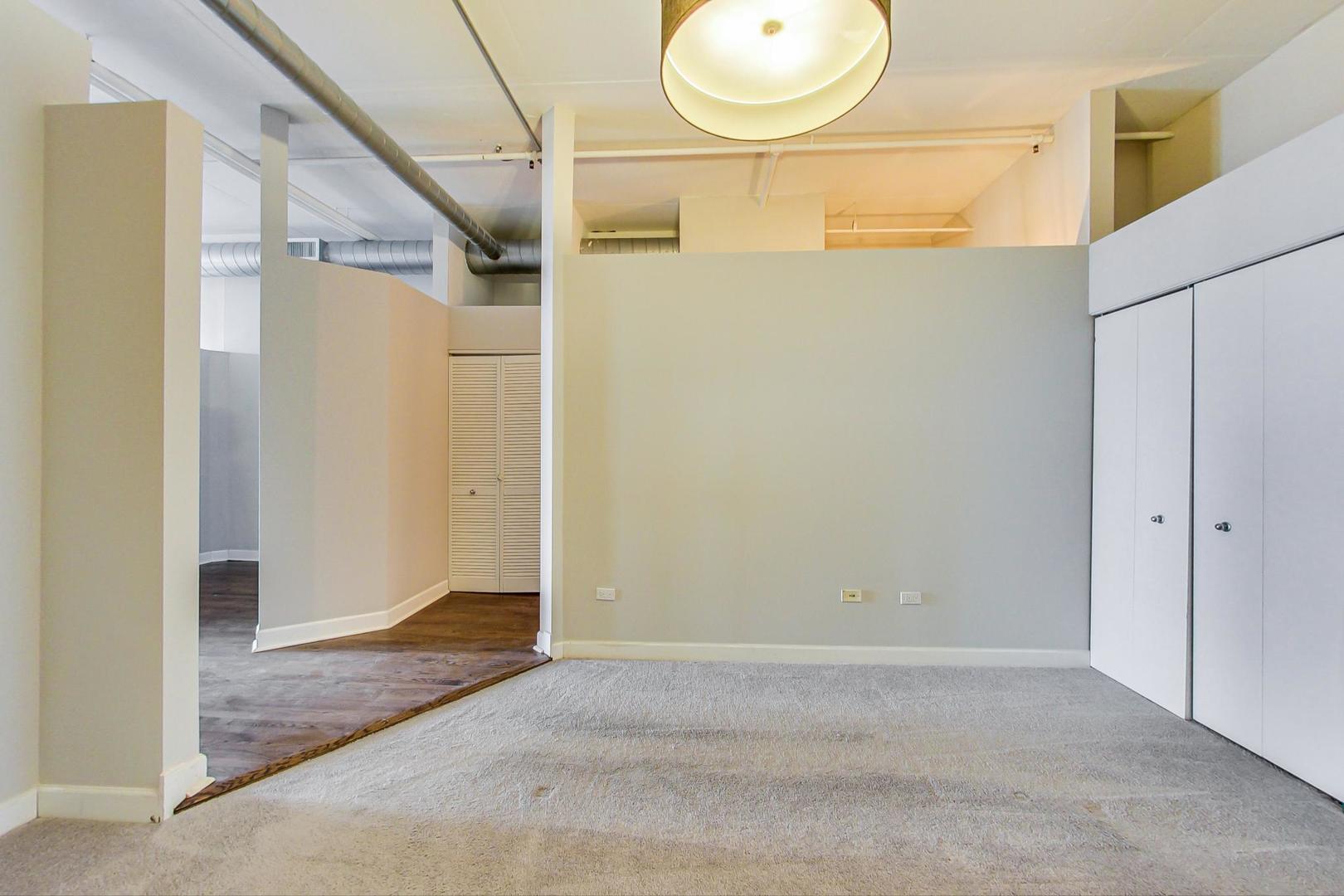 1301 West Madison Street, Unit 511 Chicago, IL 60607 - Photo 15 of 24 a view of a room with wooden door