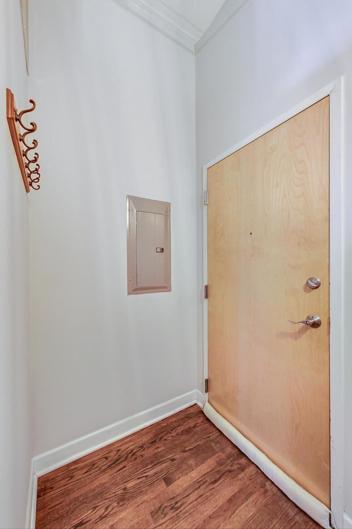1301 West Madison Street, Unit 511 Chicago, IL 60607 - Photo 20 of 24 an empty room with wooden floor and closet