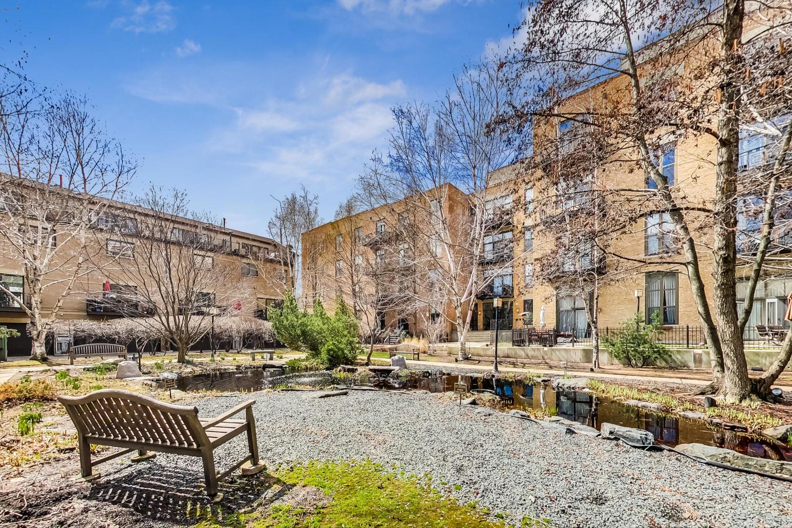 1301 West Madison Street, Unit 511 Chicago, IL 60607 - Photo 24 of 24 a view of a swimming pool with patio and a yard