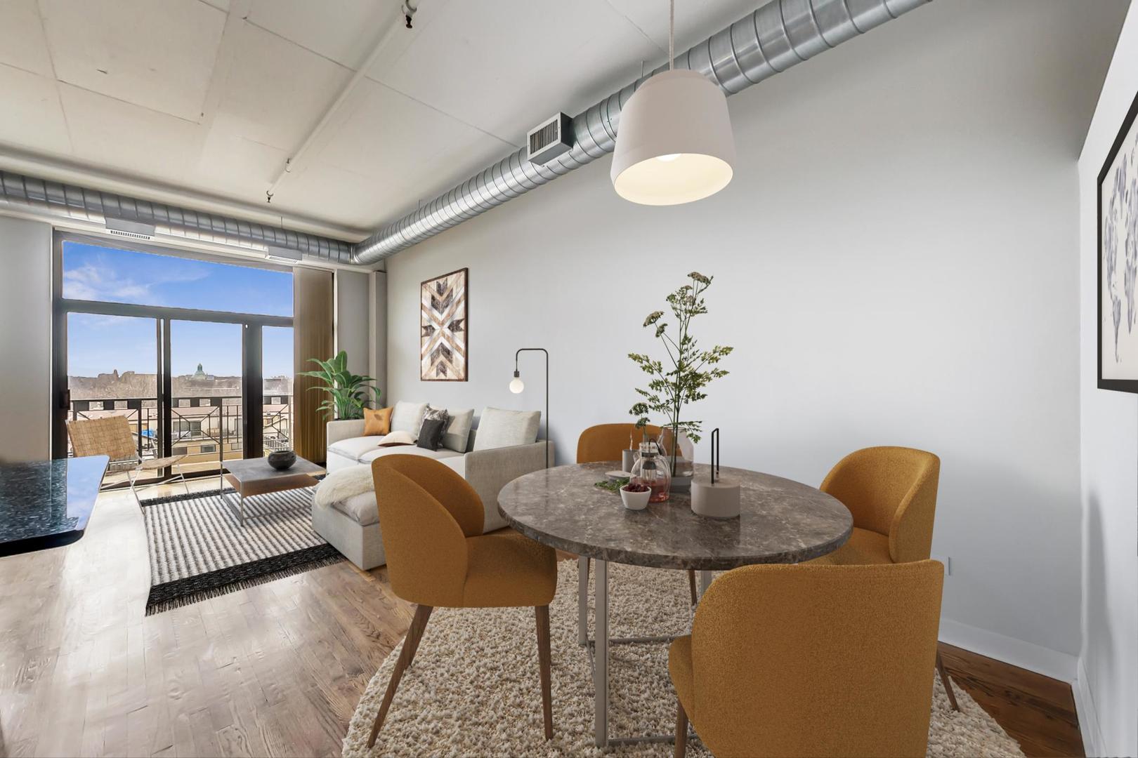 1301 West Madison Street, Unit 511 Chicago, IL 60607 - Photo 6 of 24 a dining room with furniture and wooden floor