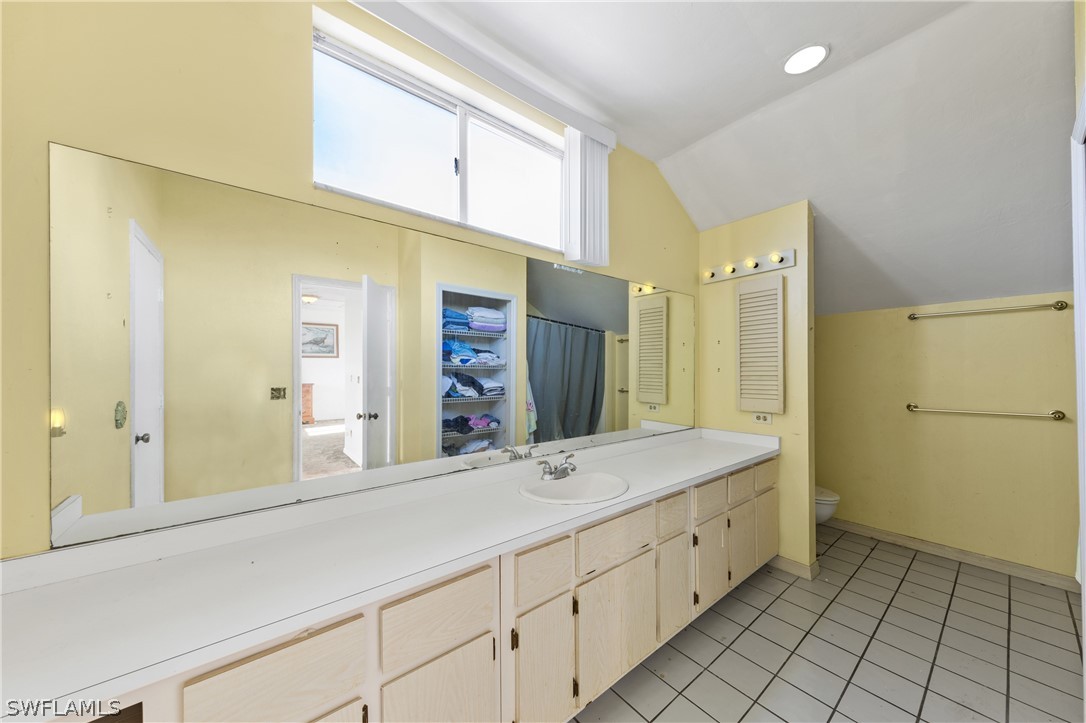 785 Rabbit Road Sanibel, FL 33957 - Photo 13 of 20 a spacious bathroom with a sink shower and a mirror