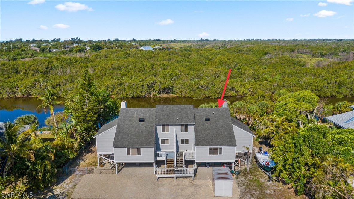 785 Rabbit Road Sanibel, FL 33957 - Photo 2 of 20 an aerial view of residential houses with outdoor space and ocean view