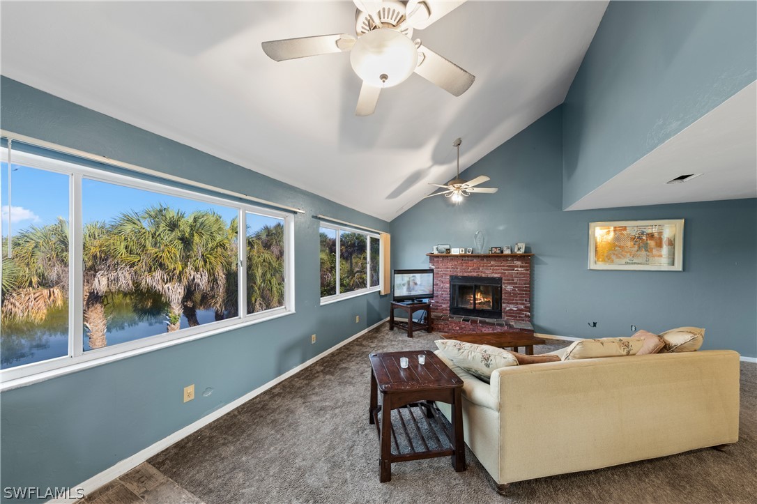 785 Rabbit Road Sanibel, FL 33957 - Photo 10 of 20 a living room with furniture and a fireplace