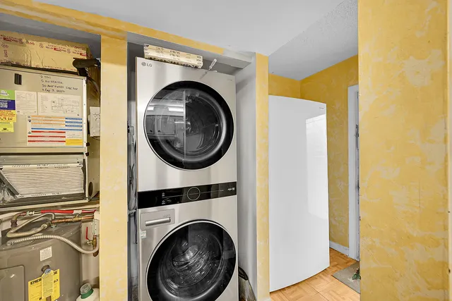 a view of a storage & utility room with a washer dryer