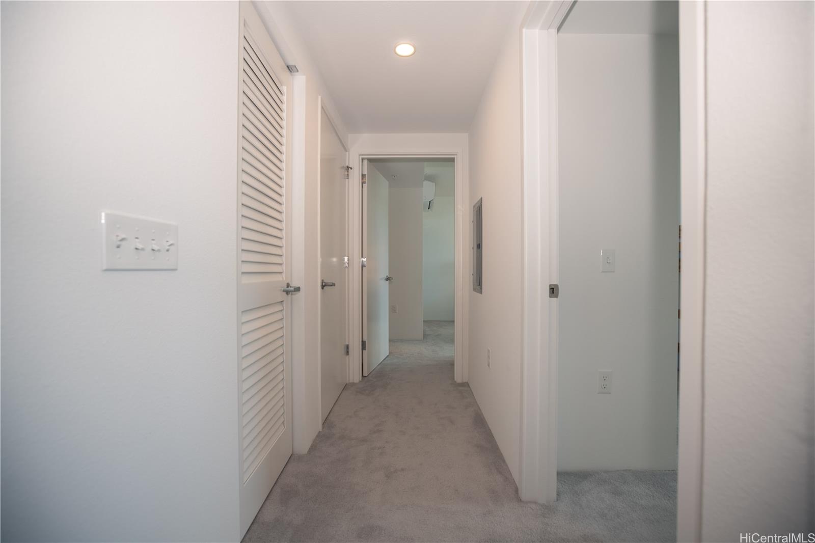615 Keawe Street, Unit 2408 Honolulu, HI 96813 - Photo 10 of 16 a view of a hallway with a elevator