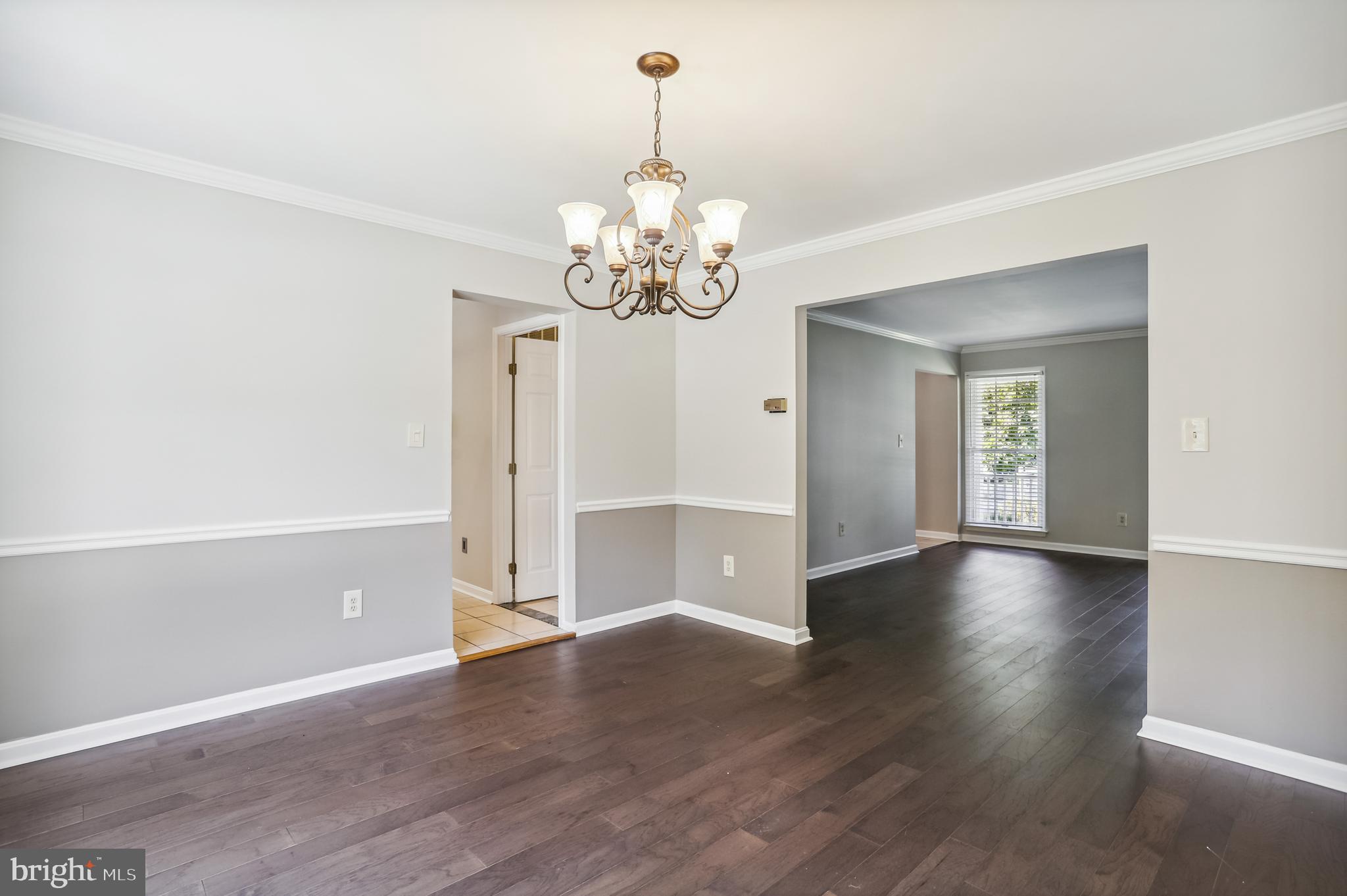 735 Evergreen Road Severn, MD 21144 - Photo 9 of 47 a view of an empty room with window and wooden floor