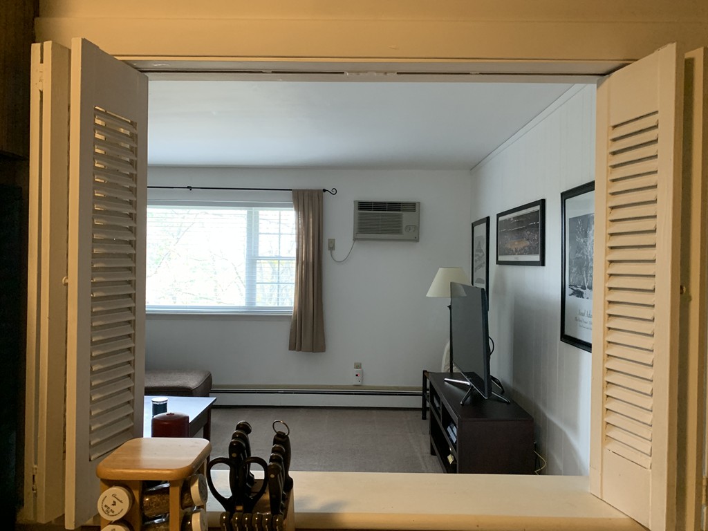 64 Jacqueline Road, Unit 12 Waltham, MA 02452 - Photo 9 of 16 a bathroom with a sink and a mirror