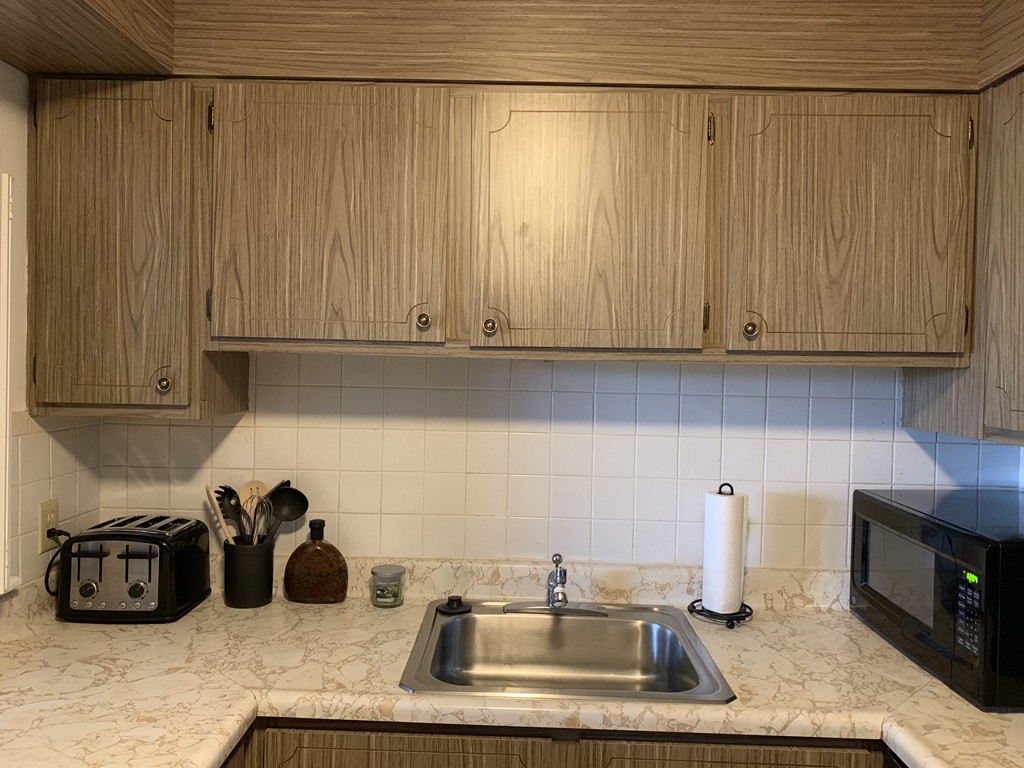 64 Jacqueline Road, Unit 12 Waltham, MA 02452 - Photo 10 of 16 a kitchen with a sink and cabinets