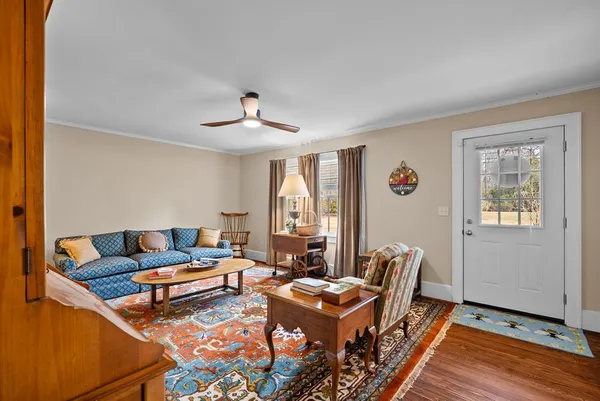 a living room with furniture and a window