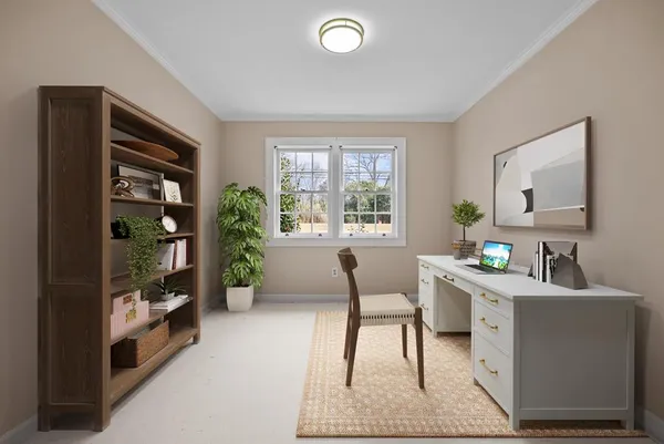 a workspace with furniture and window
