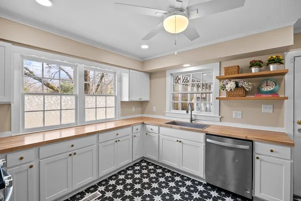 a kitchen with a sink and cabinets