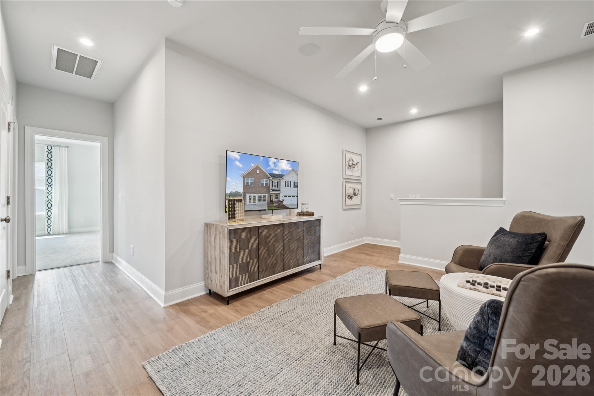 1293 Margo Mannor None Fort Mill Fort Mill, SC 29708 - Photo 16 of 32 a living room with furniture and wooden floor