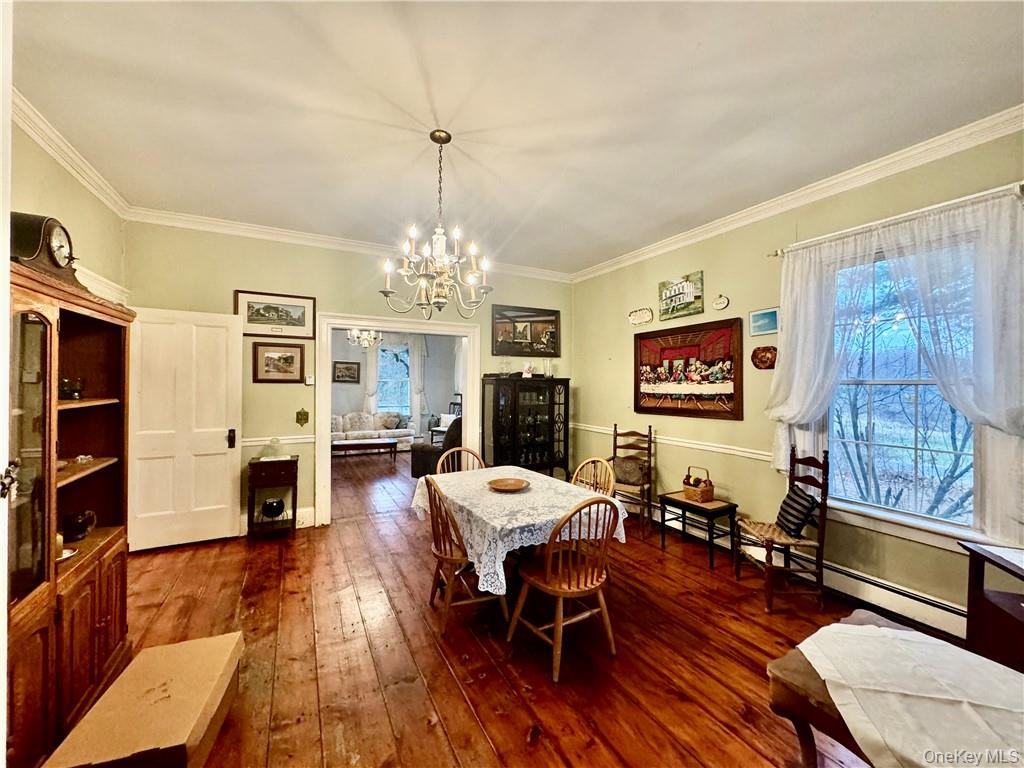 255 Howells Road Middletown, NY 10940 - Photo 12 of 38 a living room with furniture a fireplace and a window
