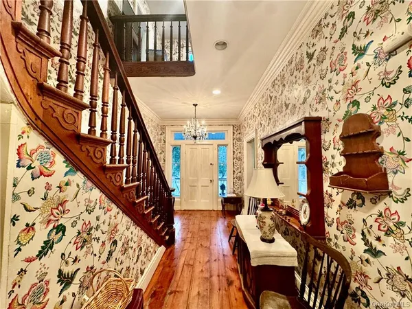 a view of an entryway with wooden floor