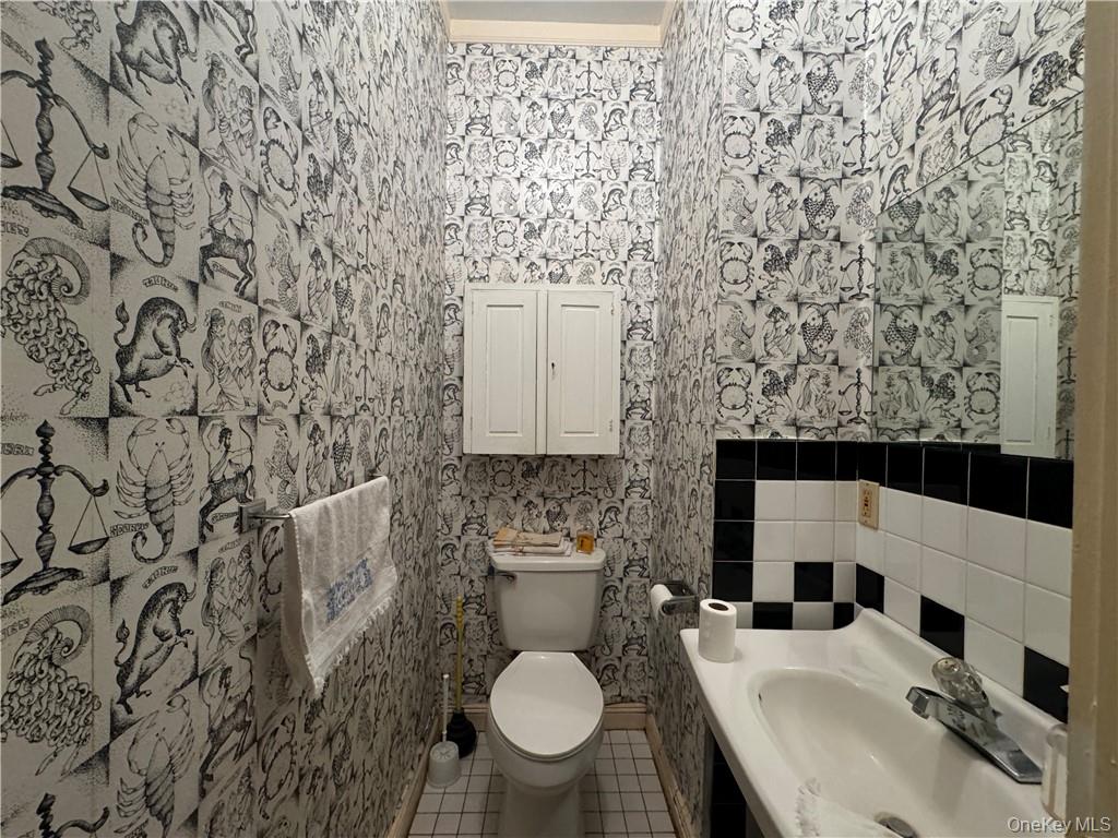 255 Howells Road Middletown, NY 10940 - Photo 18 of 38 a bathroom with a sink toilet and mirror