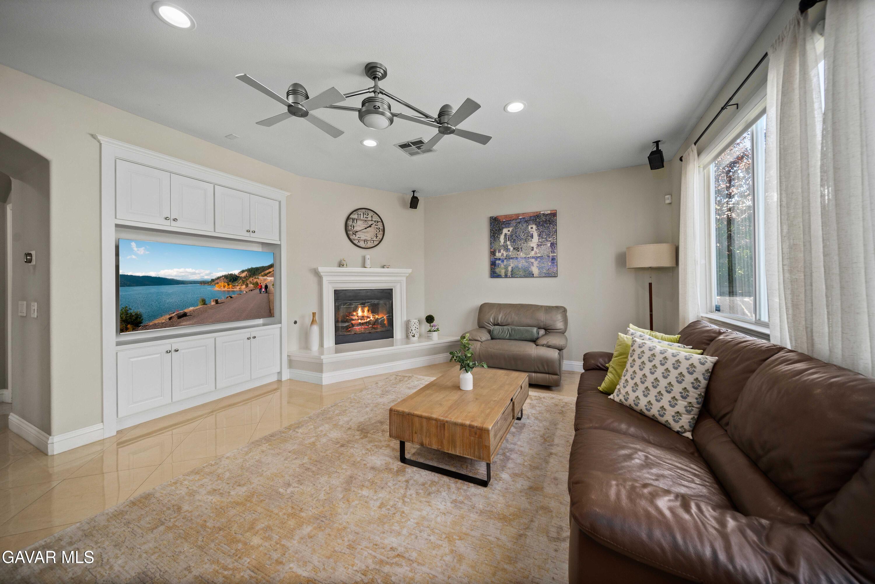 26505 Thackery Lane Stevenson Ranch, CA 91381 - Photo 16 of 63 a living room with furniture and a flat screen tv