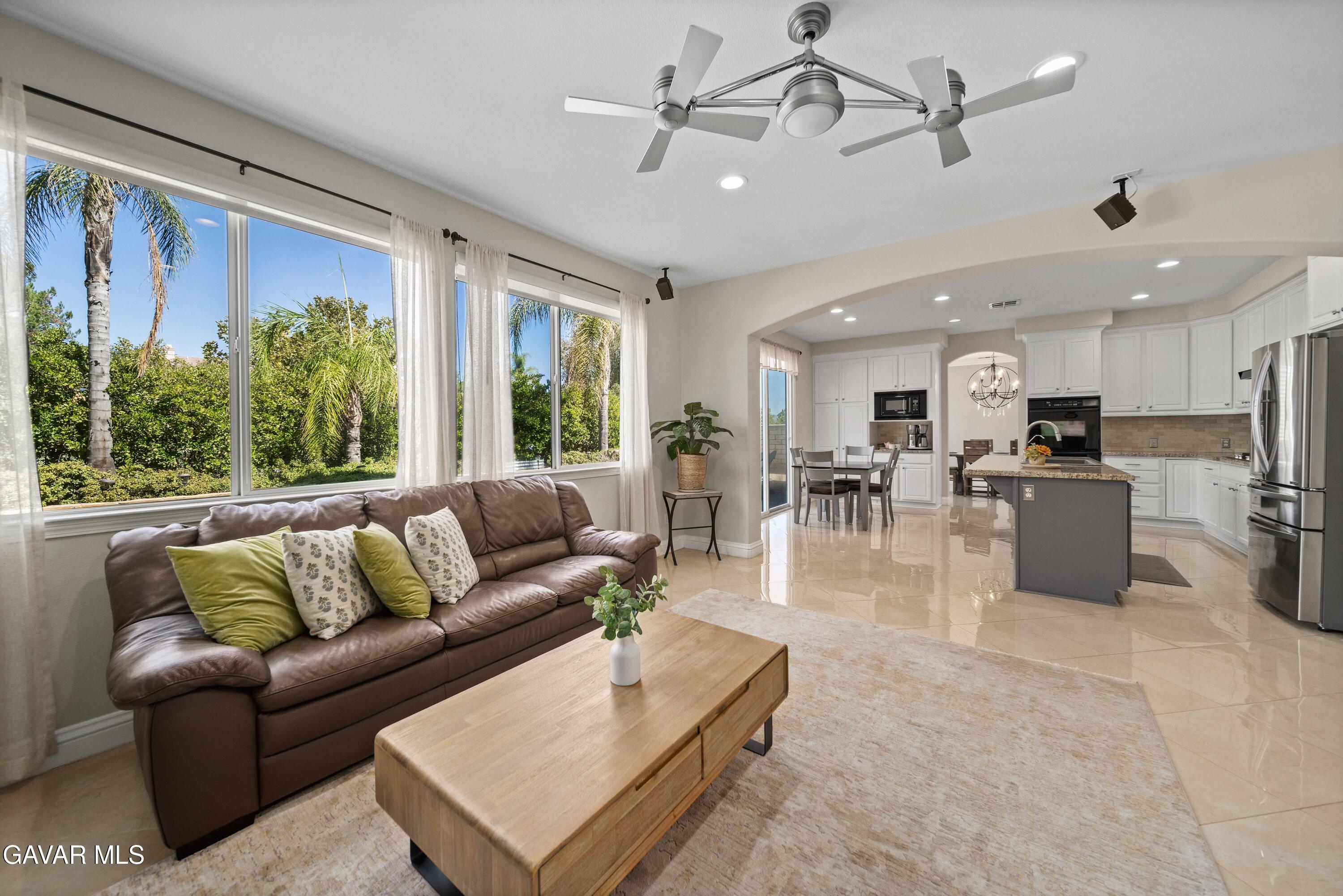 26505 Thackery Lane Stevenson Ranch, CA 91381 - Photo 17 of 63 a living room with furniture kitchen area and a large window