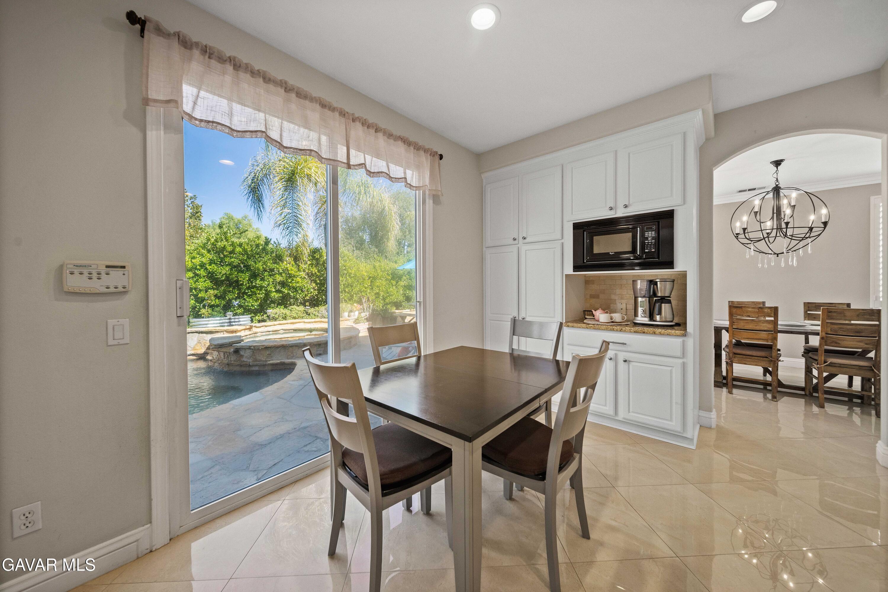 26505 Thackery Lane Stevenson Ranch, CA 91381 - Photo 22 of 63 a dining room with furniture and window