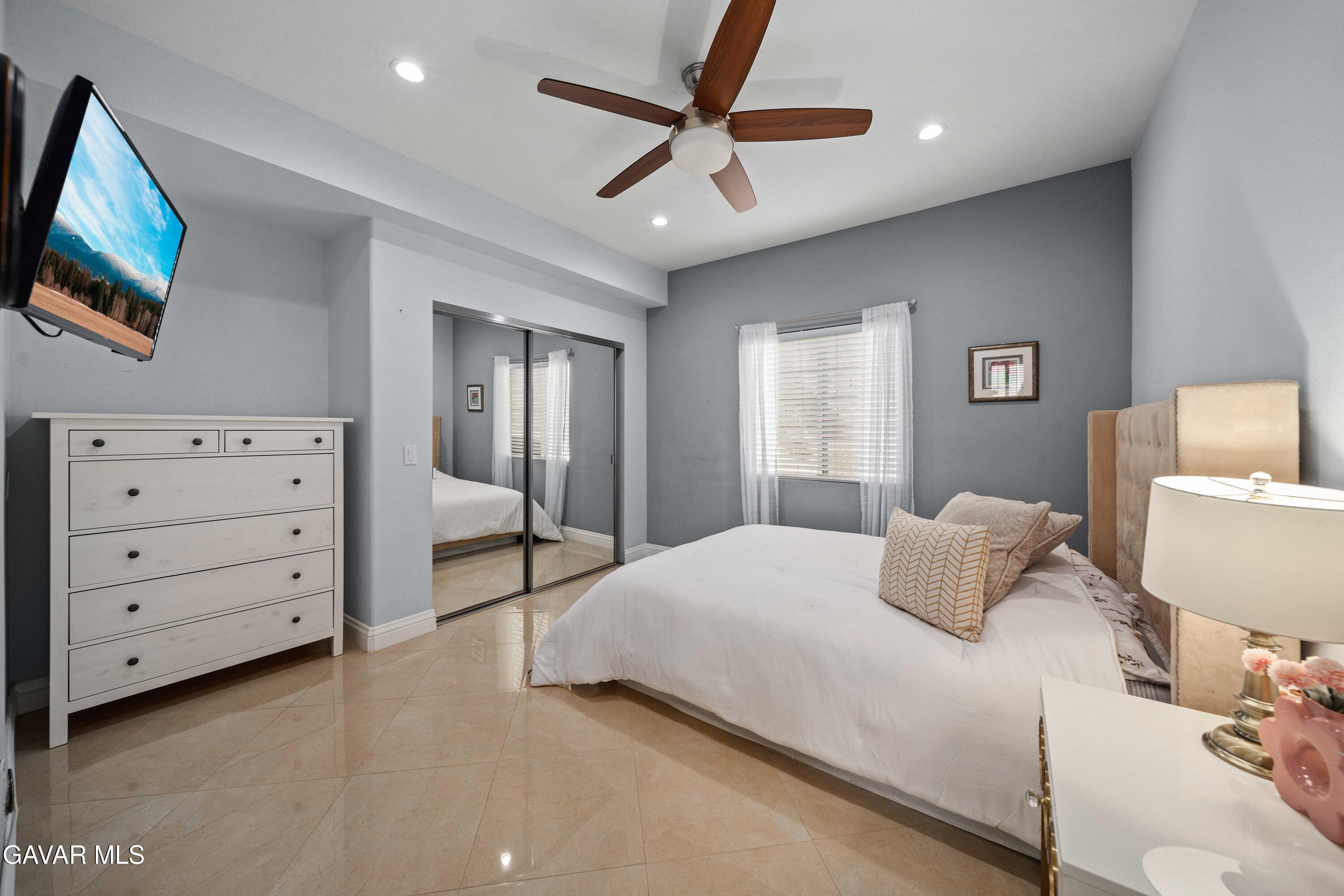 26505 Thackery Lane Stevenson Ranch, CA 91381 - Photo 30 of 63 a bedroom with a bed and a cabinets