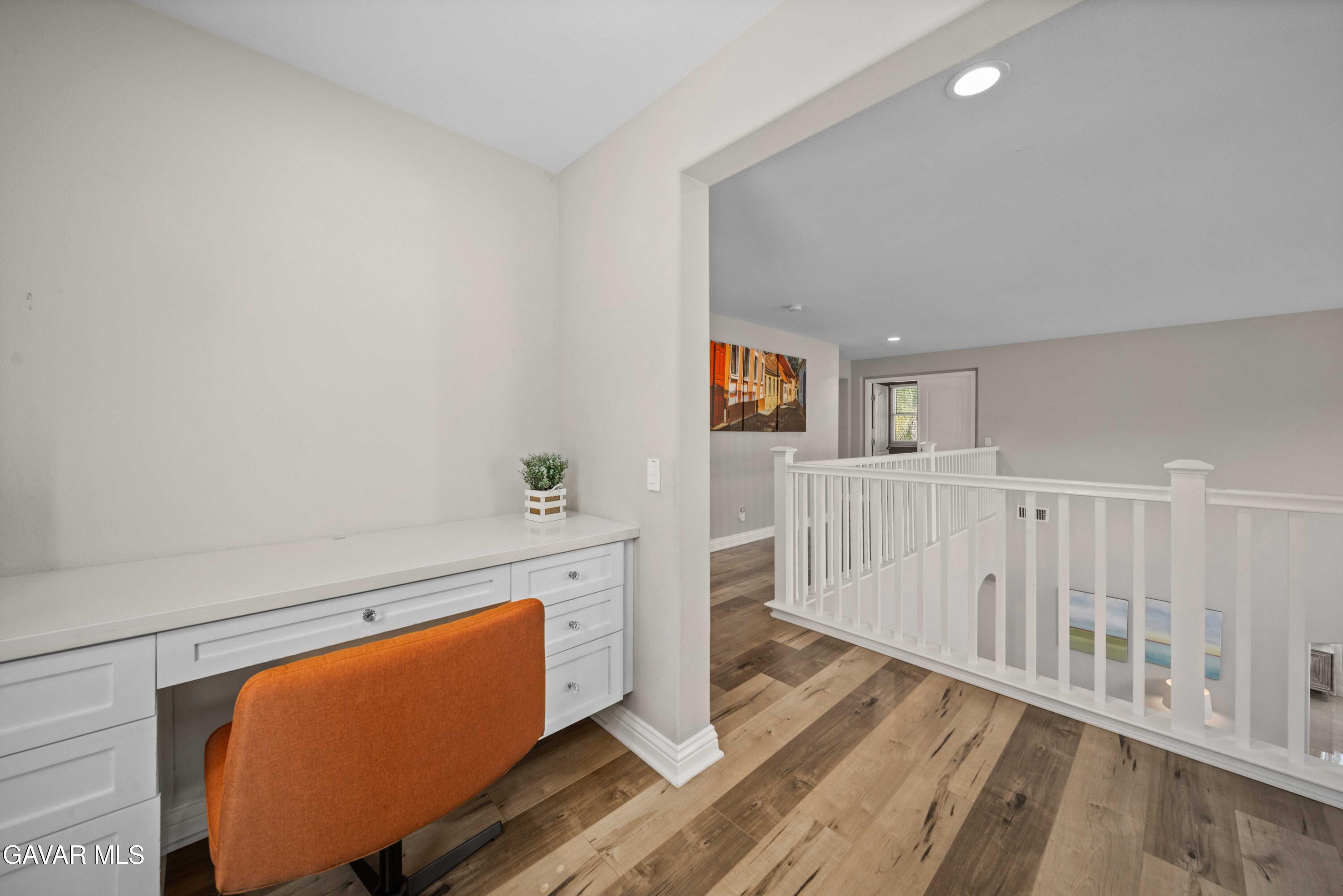 26505 Thackery Lane Stevenson Ranch, CA 91381 - Photo 36 of 63 a living room with furniture stove and a wooden floor