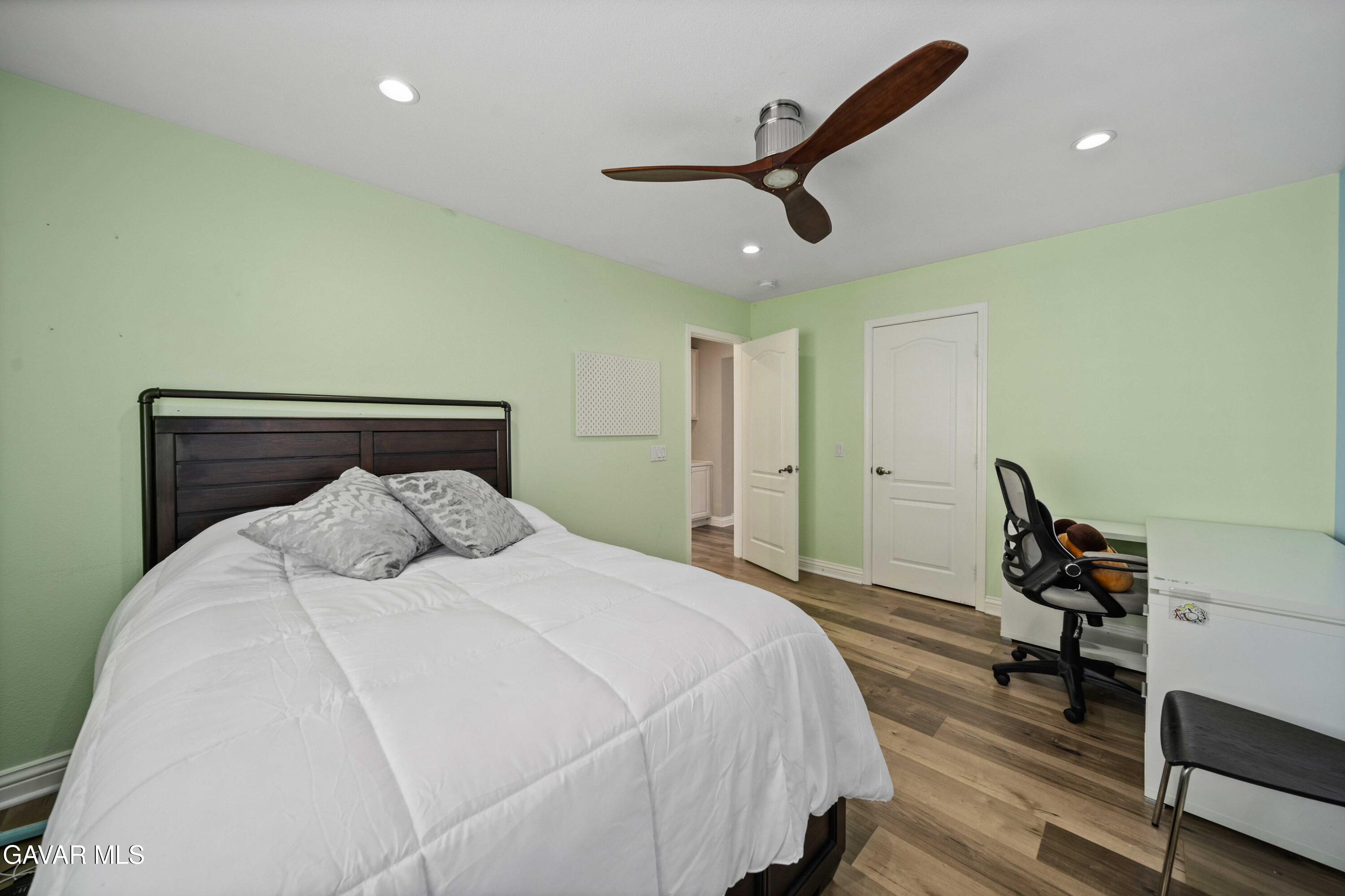 26505 Thackery Lane Stevenson Ranch, CA 91381 - Photo 42 of 63 a bedroom with a bed a desk and chair