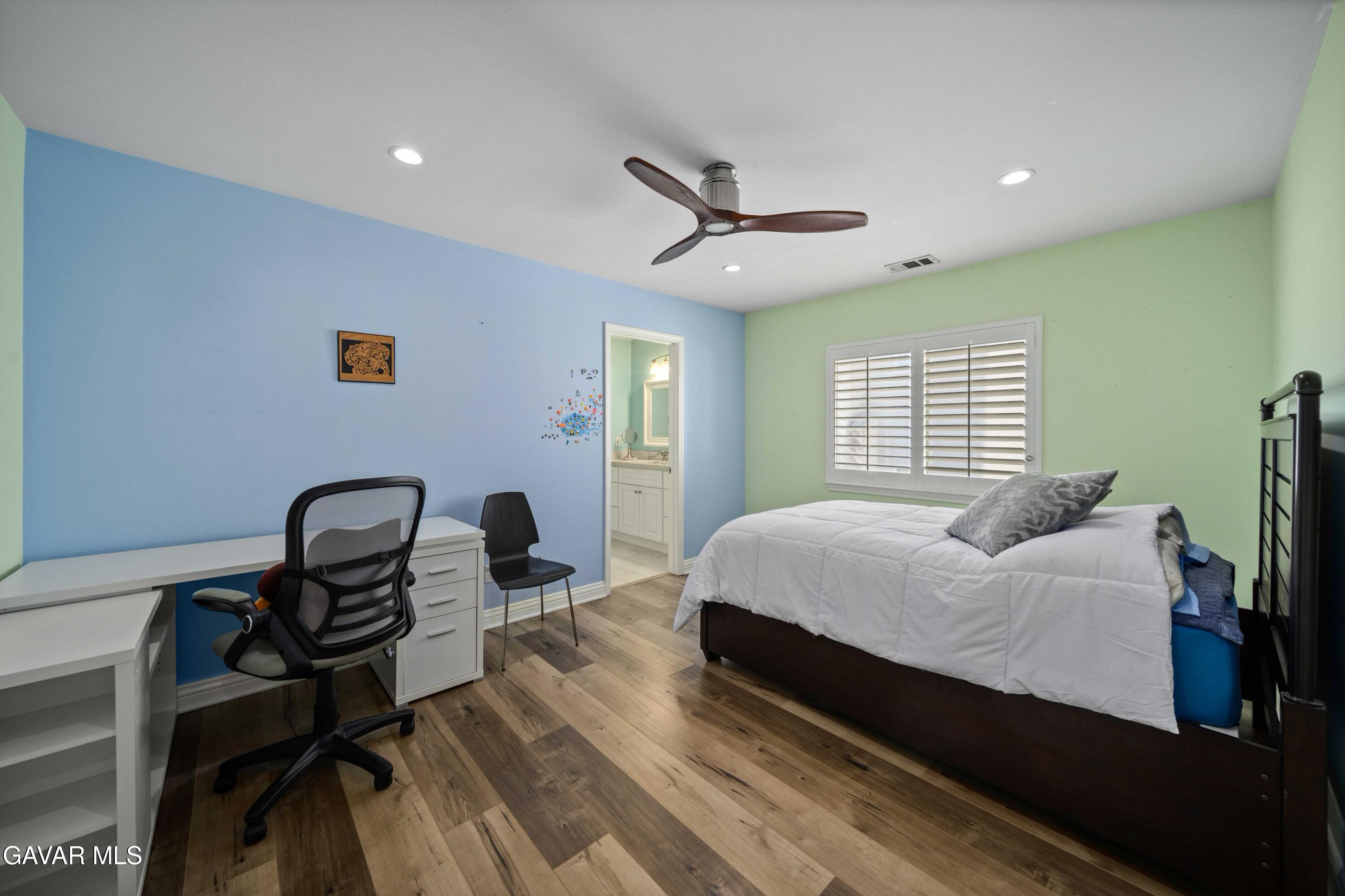 26505 Thackery Lane Stevenson Ranch, CA 91381 - Photo 43 of 63 a bedroom with a bed chairs and a window