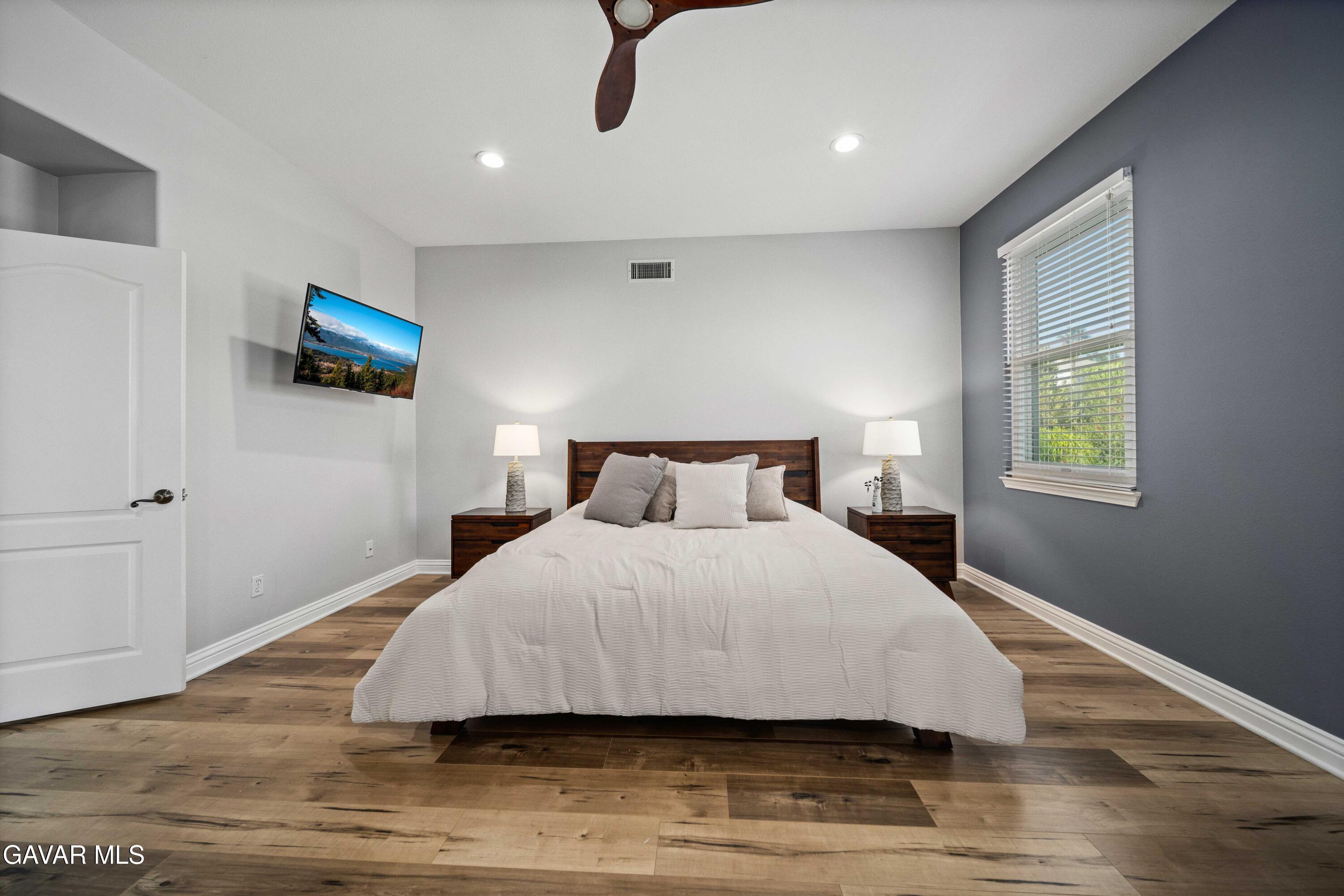 26505 Thackery Lane Stevenson Ranch, CA 91381 - Photo 51 of 63 a bedroom with a bed and a flat screen tv