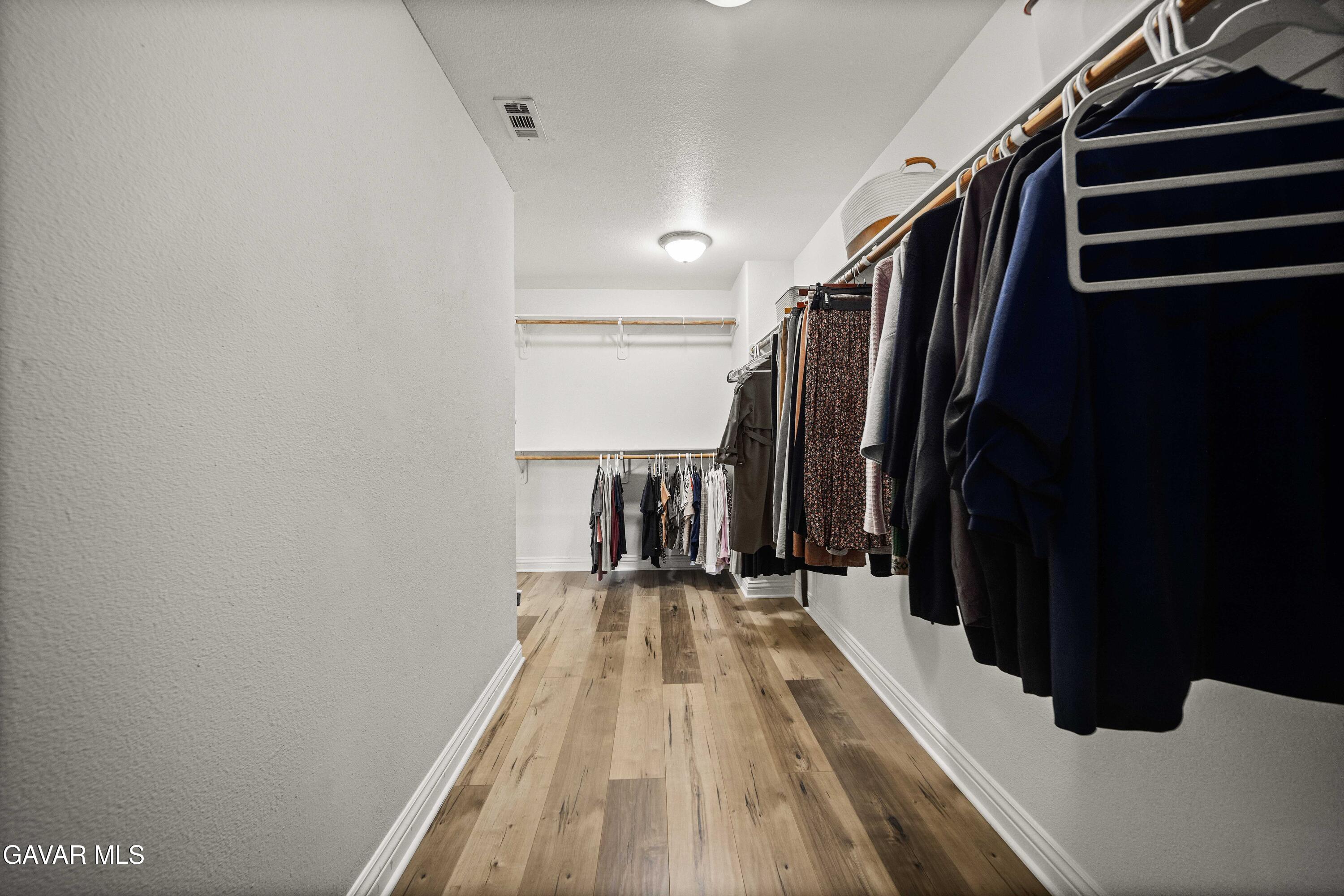 26505 Thackery Lane Stevenson Ranch, CA 91381 - Photo 56 of 63 a view of a walk in closet