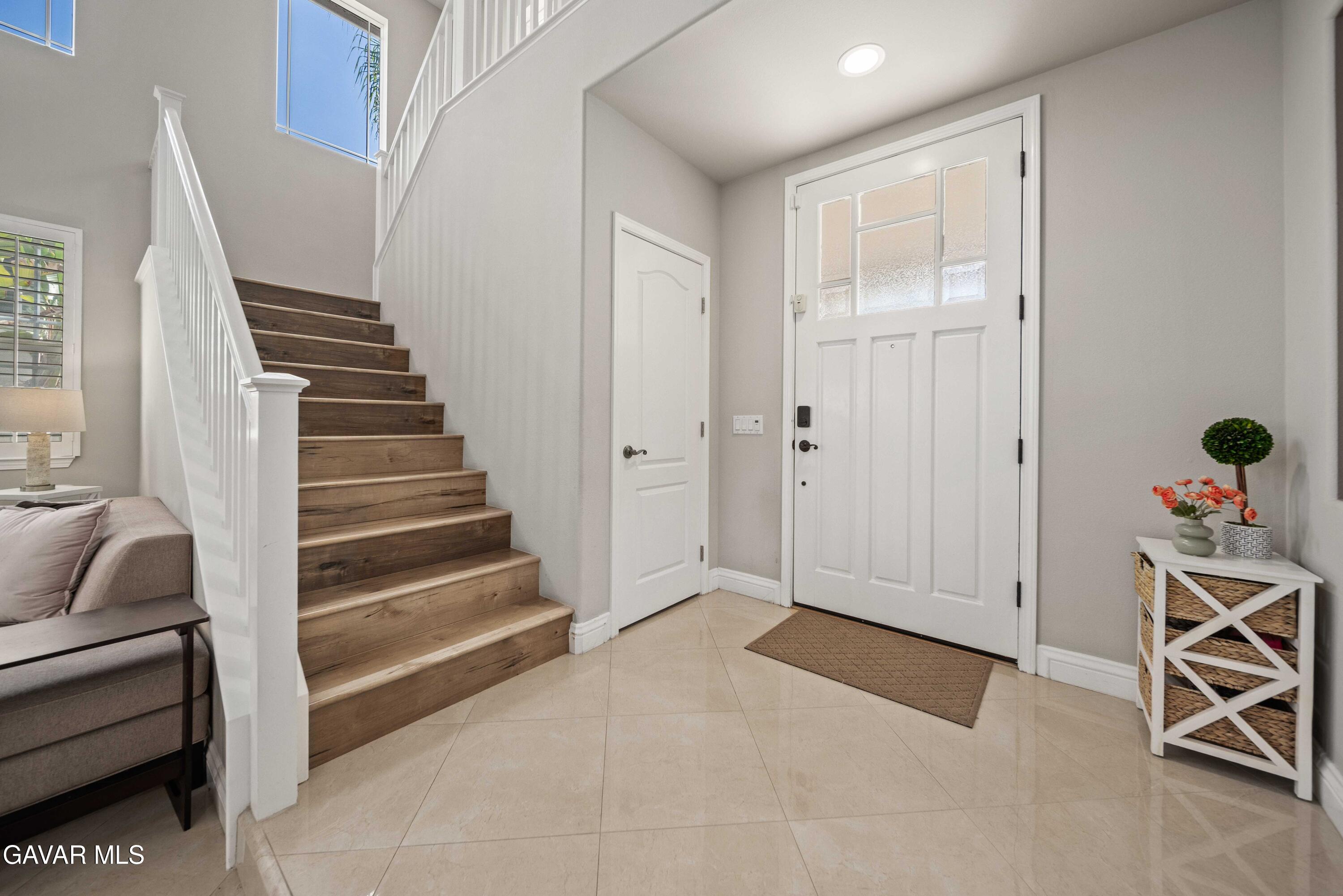 26505 Thackery Lane Stevenson Ranch, CA 91381 - Photo 6 of 63 a view of a livingroom with furniture and stairs