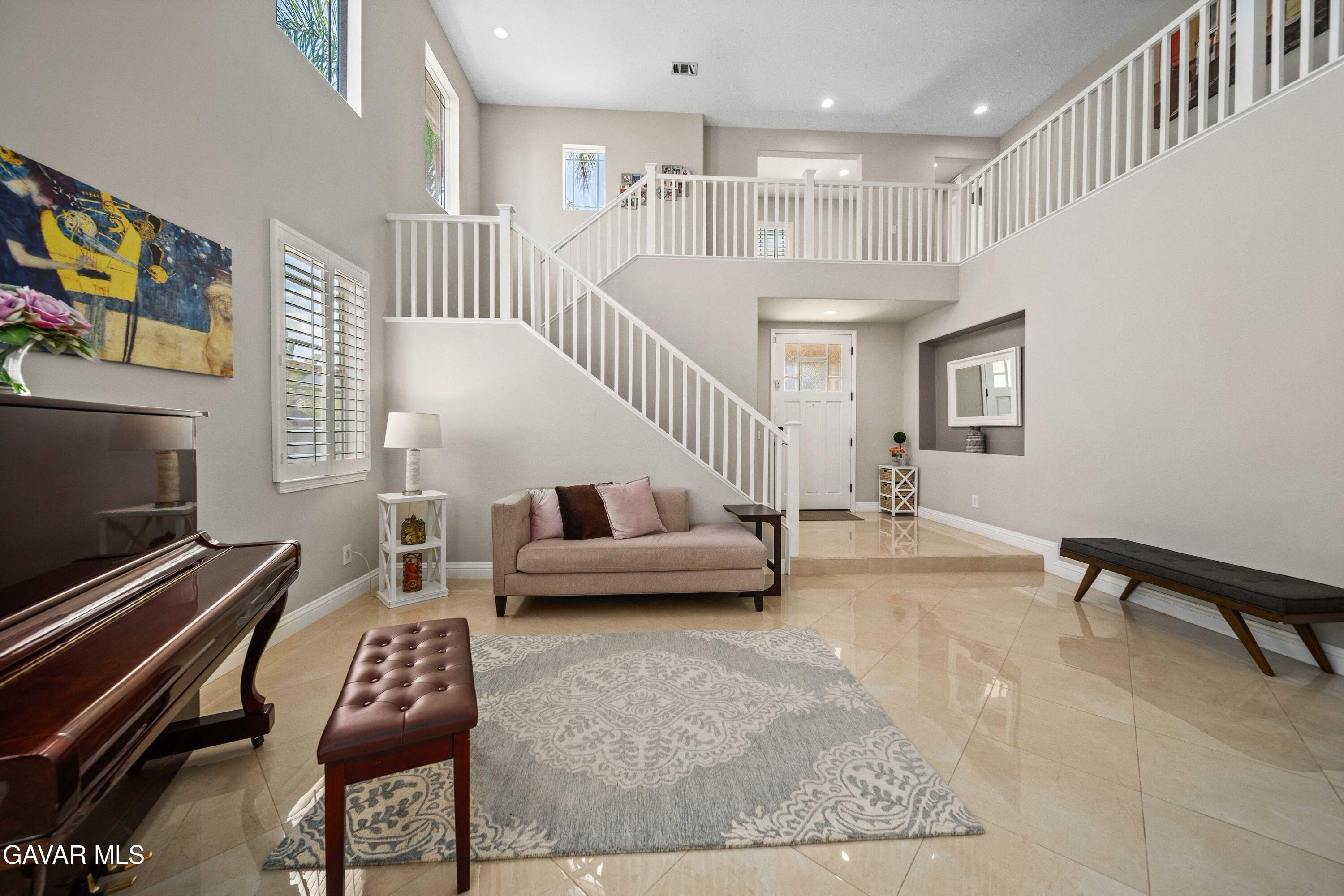 26505 Thackery Lane Stevenson Ranch, CA 91381 - Photo 7 of 63 a living room with furniture and a flat screen tv