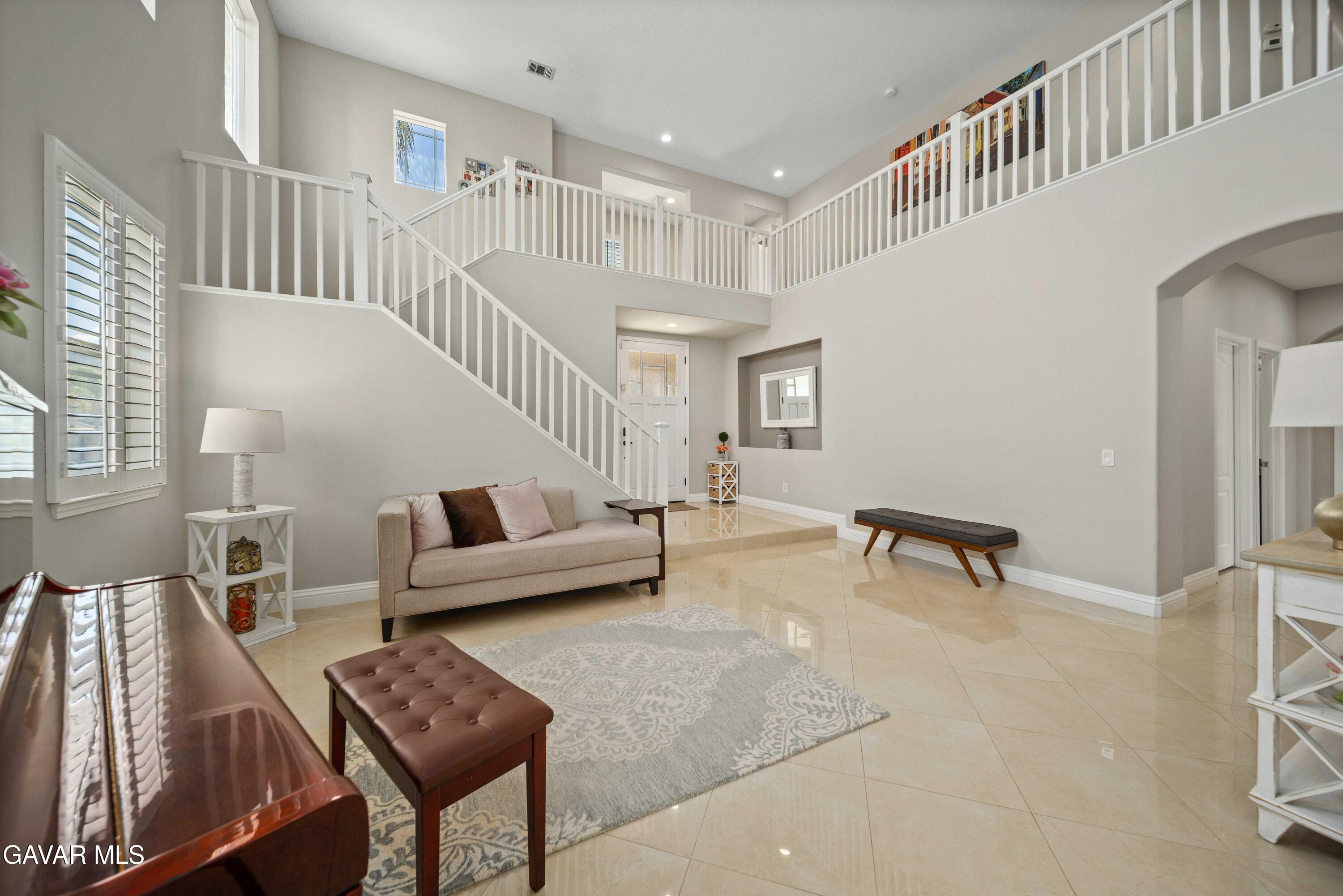 26505 Thackery Lane Stevenson Ranch, CA 91381 - Photo 8 of 63 a living room with furniture and a table