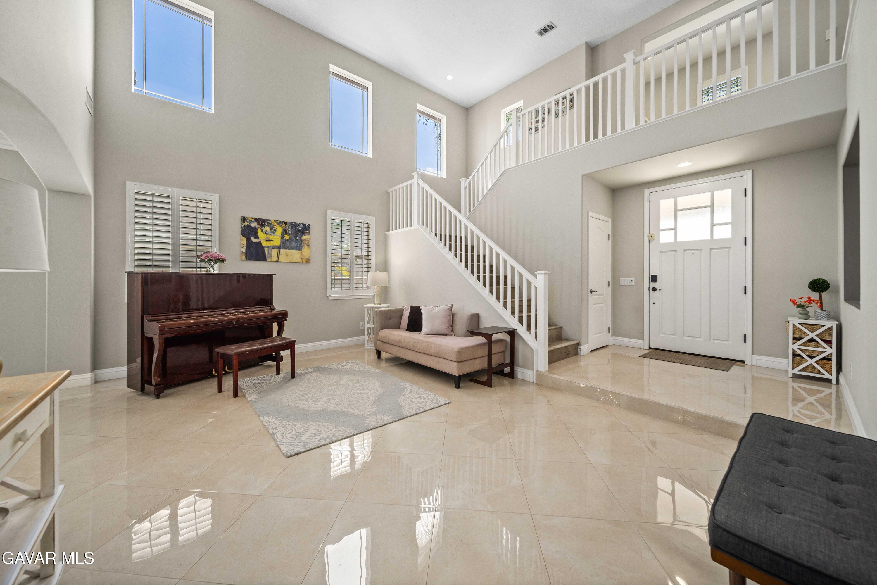 26505 Thackery Lane Stevenson Ranch, CA 91381 - Photo 9 of 63 a living room with furniture and a couch