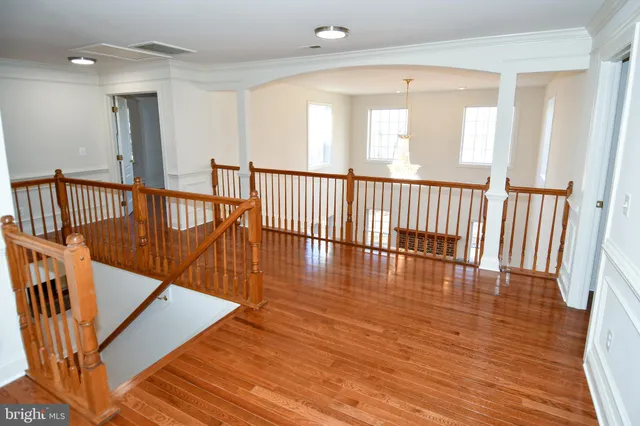 wooden floor in an empty room with windows
