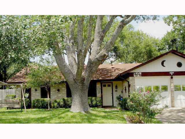7506 Glenhill Road Austin, TX 78752 - Photo 1 of 1 a view of a house with a tree in front of it